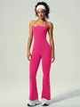 Felroze yoga jumpsuit met halternek en uitlopende pijpen voor sport en training - Rozerood