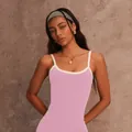 Close-up of a pink tight-fitting yoga tank top with white piping for outdoor fitness - S / Tops / Pink