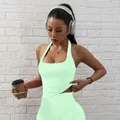 Seamless mint green halter sports bra and matching yoga leggings set for workout - XS / Tops / Pistachio Green