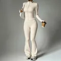 Elegant cream yoga set featuring zip-up jacket and flared pants for athletic comfort - S / Top And Bottom / Milky Apricot