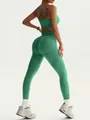 Naadloze groene yogaset met sportbeha en leggings met perziklift-effect - Sparrengroen