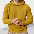 Detailed view of a men's mustard yellow hooded knit sweater with raglan sleeves and texture. - M / Tops / Yellow