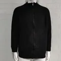 Close-up of black men's zip-up knit cardigan with a ribbed texture and high collar. - M / Tops / Black