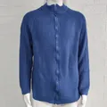 Detailed view of men's blue knitted cardigan with high collar and full zipper - Blue