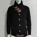 Front detail of men's black knit cardigan showing high collar and toggle buttons - S / Tops / Black