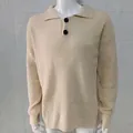 Close-up detail of a beige men's waffle knit sweater with lapel collar and buttons - M / Tops / Beige