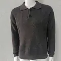 Close-up of men's grey waffle-knit polo sweater featuring detailed buttoned collar texture - Dark Gray