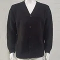 Detailed texture of men's black V-neck knitted cardigan sweater with buttons and long sleeves. - M / Tops / Black