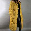 A detailed view showing the chunky cable knit texture of this long yellow cardigan - S / Tops / Yellow