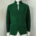 Close-up of men's dark green waffle knit cardigan featuring a stand collar and buttons - S / Tops / Green