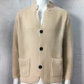 Front detail of men's beige waffle knit cardigan with stand collar and buttons - S / Tops / Off White