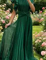 Elegant dark green pleated maxi dress with ruffled sleeves in a beautiful garden setting. - XS / Dresses / Green