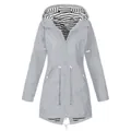 Front view of gray hooded raincoat with striped lining and adjustable drawstring waist - S / Tops / Light Gray