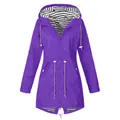 Detailed view of women's purple raincoat featuring a stylish black and white striped lining. - S / Tops / Purple