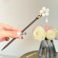 Close-up of elegant Chinese style hair stick with white flower and drop tassel - Begonia Bead Style (FZ24159)