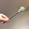 Exquisite detail of Chinese hair stick with green resin flower and beaded tassels - Green Cherry Style (FZ05209)