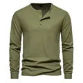 Detailed view of men's olive green long-sleeved waffle knit Henley shirt with four buttons - Army Green