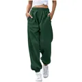 Front view of women's high-waisted dark green oversized sweatpants with pockets - S / Bottoms / Dark Green