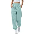Detail of women's baggy light blue sweatpants with high elastic waist and pockets - Emerald