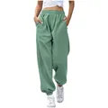 Close-up detail of high-waisted loose sage green sweatpants featuring functional pockets - Mint Green