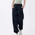 Pantalones de chándal holgados para niños con cintura elástica y puños de canalé. - Azul marino