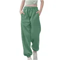 Detail van de groene joggingbroek voor kinderen met elastische taille en losse pasvorm - 110cm / Bottoms / Muntgroen