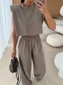 Detailed full view of women's taupe two-piece set with padded shoulder top and pants - S / Top And Bottom / Two-Piece Set / Camel