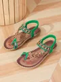 Bohemian flat sandals featuring green elastic straps and intricate floral beaded details - Green & Brown