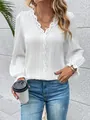Detail shot of elegant white V-neck blouse featuring delicate lace trim and pleated texture - S / Tops / White