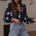 Elegant women's navy blue floral puff sleeve blouse featuring a ruffle collar and button front - S / Tops / Dark Blue