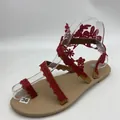 Detail showing red lace patterns on flat toe-ring sandals for a summer vacation. - 38 / Burgundy