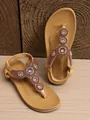 Detailed view of bohemian tan flat sandals with intricate beadwork and faux gem accents - 36 / Khaki