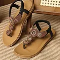 Detailed view of bohemian flat sandals with intricate bead flower embellishments. - 36 / Black Flower Style