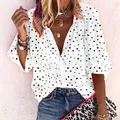 Close-up of a white V-neck long sleeve blouse featuring a trendy black polka dot print. - S / Tops / White