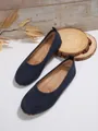 Detailed top view of navy blue suede-textured loafers for women on a rustic wood background. - 36 / Plain Blue