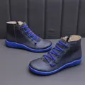 Detail view of stylish women's short boots featuring blue elastic laces and matching soles - 35 / Blue