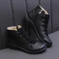 Detailed side view of black faux leather casual women's ankle boots with straps - 35 / Black