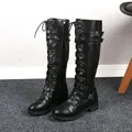 Detail of black knee-high knight boots featuring multiple buckle straps and lace-up design - 38 / Lace-up Style / Black