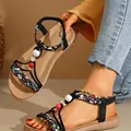 Detailed close-up of Bohemian flat sandals featuring braided straps and colorful beads - 36 / Black