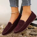 Close-up of stylish burgundy suede loafers with white stitching worn with cuffed blue jeans - 36 / Regular Fit / Burgundy