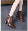 Detail shot of brown pointed-toe ankle boots with thick heels and metal buckle - 35 / Brown Rhinestone