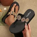 Detailed view of women's black platform flip-flops with sparkling rhinestone ornaments - 36 / Circle Rhinestone Black
