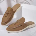 Detailed view of brown suede backless mules featuring decorative gold-tone hardware - 36 / European Loafer Mules (1012) / Backless Brown