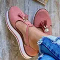 Women's casual pink platform sandals featuring stylish tassel detail and adjustable ankle strap - Pink