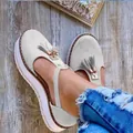 Stylish grey suede platform sandals with decorative tassels and T-strap for women. - Off White