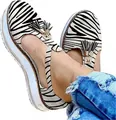 Women's zebra print platform sandals featuring decorative tassels and thick white soles - Zebra Print