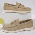 Detailed view of khaki suede loafers with elegant metal buckle on white pedestal - 43 / Tassel Metal Buckle Loafers (1012) / Khaki