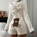 Detail view of plush hooded romper with cute bear patch on back and cable knit texture - S / Set / White