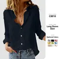Detail view of women's long-sleeve button-up casual solid color shirt in navy blue - S / Tops / Black