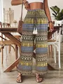 Detail of bohemian printed high waist trousers with elastic waistband and tassels - S / Bottoms / Yellow